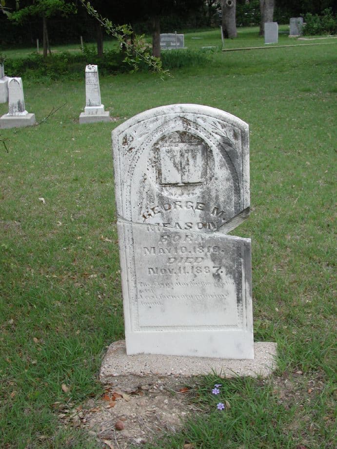 Broken grave marker for George M. Meason at Mount Calvary Cemetery in Dallas